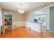 Cozy dining room featuring vintage wallpaper and easy access to the kitchen at 1636 Pinopolis Rd, Moncks Corner, SC 29461