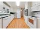 Bright kitchen with ample storage, white appliances, and functional layout at 1636 Pinopolis Rd, Moncks Corner, SC 29461