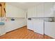 Convenient laundry room with washer, dryer, and ample storage cabinets at 1636 Pinopolis Rd, Moncks Corner, SC 29461