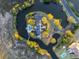 Aerial view of waterfront estate featuring a private pool, circular driveway, and lush landscaping at 1644 Omni Blvd, Mount Pleasant, SC 29466