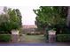 Wide angle view of a lush backyard with a fountain, mature trees and landscaping at 1644 Omni Blvd, Mount Pleasant, SC 29466