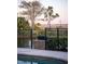 Scenic backyard with pool, serene pond view, and lush landscaping at 1644 Omni Blvd, Mount Pleasant, SC 29466