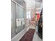 Elegant bathroom featuring a glass-enclosed shower, decorative wallpaper, and stylish accents at 1644 Omni Blvd, Mount Pleasant, SC 29466