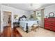 Bright bedroom featuring a large bed with decorative pillows and stylish side tables at 1644 Omni Blvd, Mount Pleasant, SC 29466