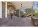 Stately brick home featuring a grand arched entrance and lush landscaping at 1644 Omni Blvd, Mount Pleasant, SC 29466