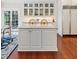 Bright kitchen featuring a marble island and custom cabinetry at 1644 Omni Blvd, Mount Pleasant, SC 29466