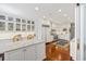 Spacious kitchen with white cabinets, marble counters, and stainless steel appliances at 1644 Omni Blvd, Mount Pleasant, SC 29466