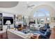 Bright living room with vaulted ceiling, fireplace, built-ins, and views at 1644 Omni Blvd, Mount Pleasant, SC 29466