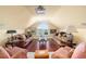 Cozy living room with comfortable seating, warm lighting, and a projector mounted on the ceiling at 1644 Omni Blvd, Mount Pleasant, SC 29466