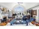 Spacious living room with fireplace, vaulted ceilings, and serene waterfront views at 1644 Omni Blvd, Mount Pleasant, SC 29466