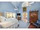 Spacious main bedroom with ensuite bath, four-poster bed, and blue accents at 1644 Omni Blvd, Mount Pleasant, SC 29466