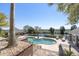 Backyard in-ground pool with lounging area and landscaping overlooking waterway at 1644 Omni Blvd, Mount Pleasant, SC 29466