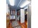 Walk-in closet with hanging racks and dresser, with rugs on the floor at 1644 Omni Blvd, Mount Pleasant, SC 29466