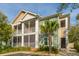 Attractive two-story condo with screened patios, green and beige siding, and mature landscaping at 1755 Central Park Rd # 3102, Charleston, SC 29412