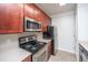 This kitchen is equipped with stainless steel appliances and granite countertops at 1755 Central Park Rd # 3102, Charleston, SC 29412
