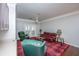 Inviting living room featuring a red plaid rug, comfortable seating, and plenty of natural light at 1755 Central Park Rd # 3102, Charleston, SC 29412