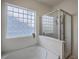 Bright bathroom with separate shower and tub, privacy window, and modern fixtures at 189 Weeping Cypress Dr, Moncks Corner, SC 29461