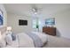Comfortable bedroom featuring a soft bed, ceiling fan, and ample natural light with carpet floor at 189 Weeping Cypress Dr, Moncks Corner, SC 29461