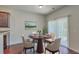 Cozy dining area featuring a wood table with four chairs, white rug, and sliding doors for natural light at 189 Weeping Cypress Dr, Moncks Corner, SC 29461