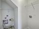 Functional laundry room featuring washer/dryer hookups and overhead shelving for organized storage at 189 Weeping Cypress Dr, Moncks Corner, SC 29461