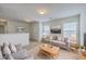 Comfortable living room with neutral furniture, ample natural light, and stylish decor and lighting at 189 Weeping Cypress Dr, Moncks Corner, SC 29461