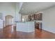 Spacious open-concept living area featuring hardwood floors, vaulted ceilings, and a breakfast bar connecting to the kitchen at 189 Weeping Cypress Dr, Moncks Corner, SC 29461
