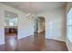 Open-concept living room featuring hardwood floors, recessed lighting, and an arched opening to the kitchen at 189 Weeping Cypress Dr, Moncks Corner, SC 29461