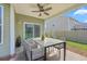 Covered patio with outdoor seating, ideal for dining and relaxing in the backyard at 189 Weeping Cypress Dr, Moncks Corner, SC 29461