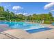 Beautiful community pool area surrounded by lounge chairs, perfect for relaxation and recreation at 189 Weeping Cypress Dr, Moncks Corner, SC 29461