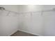 Walk-in closet with wire shelving and carpeted floor, providing ample storage space at 189 Weeping Cypress Dr, Moncks Corner, SC 29461
