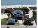 Stunning aerial view of a gorgeous house with beach access near the blue ocean at 1908 Palmetto Boulevard Blvd, Edisto Island, SC 29438