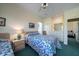 Bedroom with two twin beds, a ceiling fan, and natural light at 1908 Palmetto Boulevard Blvd, Edisto Island, SC 29438