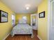 Cozy bedroom featuring a queen sized bed and access to an on-suite bathroom at 1908 Palmetto Boulevard Blvd, Edisto Island, SC 29438