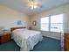 Bedroom with a bed, a nightstand, and a large window at 1908 Palmetto Boulevard Blvd, Edisto Island, SC 29438