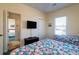 Bedroom with two twin beds, a TV, and closet space at 1908 Palmetto Boulevard Blvd, Edisto Island, SC 29438