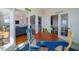 Sunlit dining room with colorful chairs, ocean views, and an open layout connected to the living area at 1908 Palmetto Boulevard Blvd, Edisto Island, SC 29438