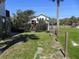 Lovely home with a well-maintained lawn, palm trees, and charming coastal architecture at 1908 Palmetto Boulevard Blvd, Edisto Island, SC 29438