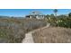 Charming coastal home with a private boardwalk leading through the dunes to the beach at 1908 Palmetto Boulevard Blvd, Edisto Island, SC 29438