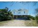 Beautifully constructed coastal home elevated on pilings featuring a circular accent window at 1908 Palmetto Boulevard Blvd, Edisto Island, SC 29438