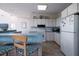Well-lit kitchen featuring ample counter space and bar seating at 1908 Palmetto Boulevard Blvd, Edisto Island, SC 29438