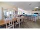Open-concept living space with dining area, kitchen, and vaulted ceilings at 1908 Palmetto Boulevard Blvd, Edisto Island, SC 29438