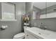 Clean bathroom with a white vanity and a well lit mirror at 1932 Sunnyvale Ave, Charleston, SC 29414