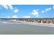 Breathtaking aerial view of beachfront homes nestled along the pristine shoreline with clear ocean waters at 212 Ocean Blvd, Isle of Palms, SC 29451