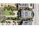 Overhead view of landscaped home with a pool, driveway, and lush greenery near the beach at 212 Ocean Blvd, Isle of Palms, SC 29451