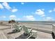 Enjoy panoramic ocean views from the spacious balcony with comfortable Adirondack chairs at 212 Ocean Blvd, Isle of Palms, SC 29451