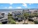 Beautiful coastal home with ocean views, a spacious front porch, and lush tropical landscaping at 212 Ocean Blvd, Isle of Palms, SC 29451