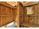 Rustic outdoor shower constructed from wood with dual showerheads and a small bench at 212 Ocean Blvd, Isle of Palms, SC 29451