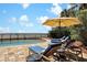 Inviting pool area with a privacy fence, comfortable lounge chairs, and a scenic view at 212 Ocean Blvd, Isle of Palms, SC 29451
