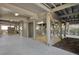 Open space under a raised home with exposed support beams, stairs, and a concrete pad at 212 Ocean Blvd, Isle of Palms, SC 29451