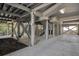 Underneath a raised house showing a lot of support beams and stairs at 212 Ocean Blvd, Isle of Palms, SC 29451